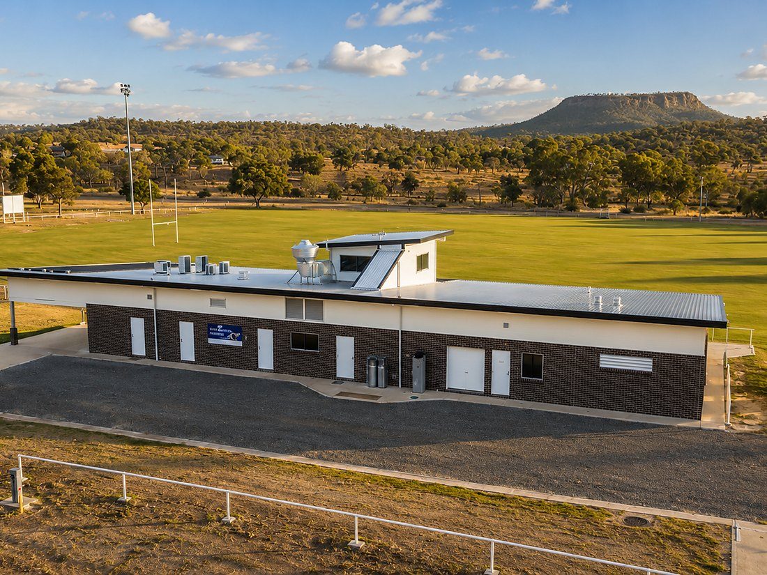 Community sports pavilion beside a playing field in rural Queensland